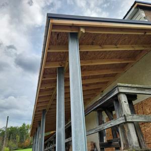 New Roof getting started over the Porch.jpg