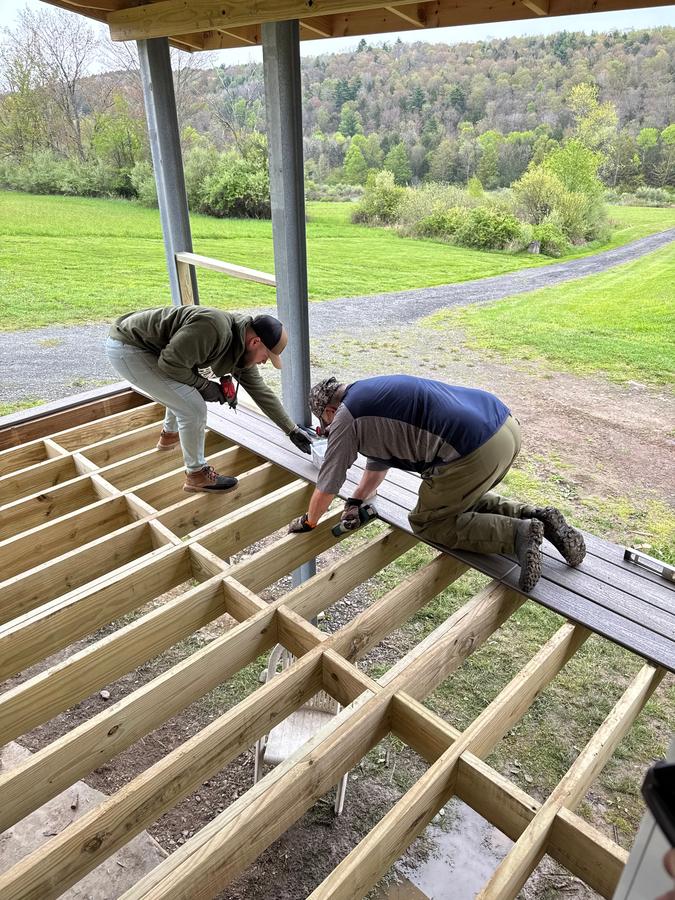 Andrew Gehman and Fred Mertz hard at work on the new porch