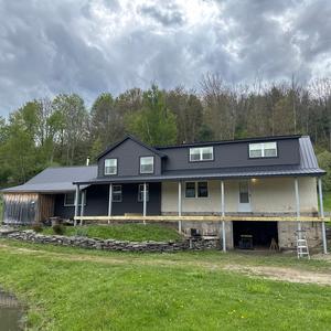 New siding and roof on the front side